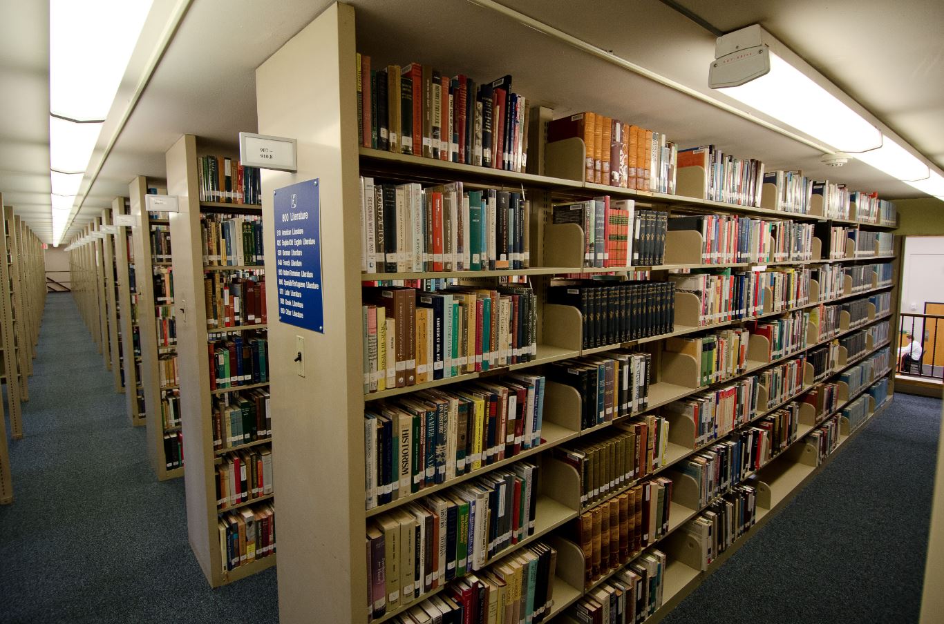 Library aisles representing a journey of discovery through knowledge